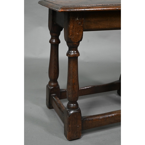 845 - A 17th century style elm joint stool, on turned supports, 53 cm x 27 cm x 50 cm h