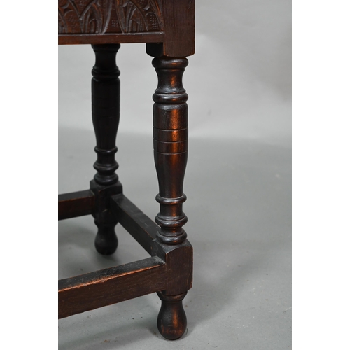 847 - A 17th century style oak joint stool, the single plank seat over a lunette carved frieze, 45 cm x 27... 