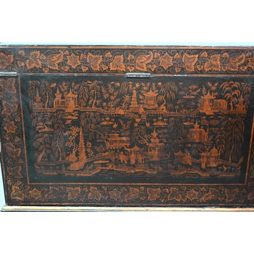 850 - A late 18th/19th century Chinese export all-round black and gilt pictorial lacquered trunk, raised o... 