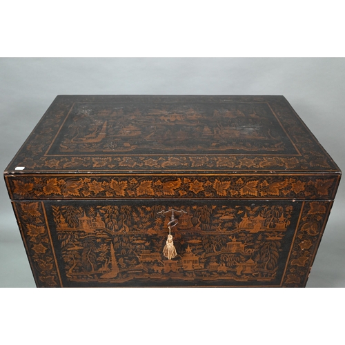 850 - A late 18th/19th century Chinese export all-round black and gilt pictorial lacquered trunk, raised o... 