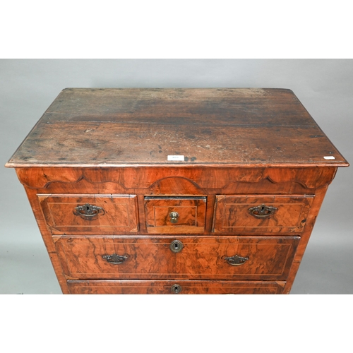 855 - An early 18th century walnut chest of three short over three long graduated drawers, raised on shape... 