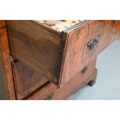 855 - An early 18th century walnut chest of three short over three long graduated drawers, raised on shape... 