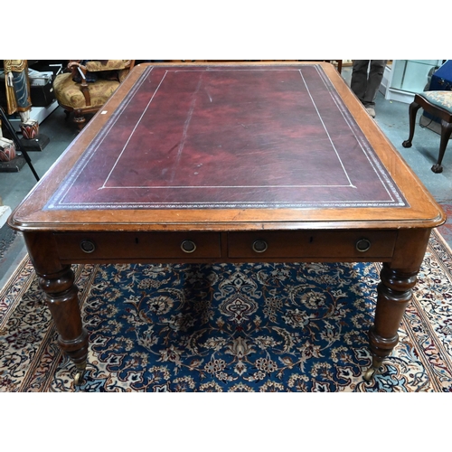 859 - A 19th century mahogany library table, the silver tooled burgundy leather inset top over a pair of f... 