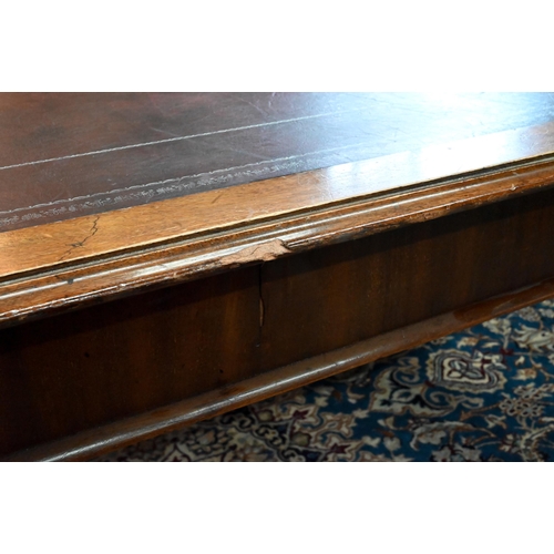 859 - A 19th century mahogany library table, the silver tooled burgundy leather inset top over a pair of f... 