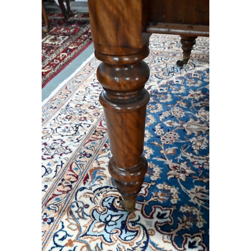 859 - A 19th century mahogany library table, the silver tooled burgundy leather inset top over a pair of f... 