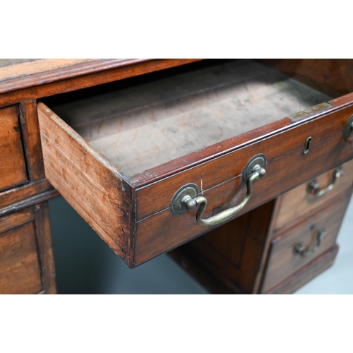 860 - A Victorian mahogany partner's desk, the gilt tooled green leather inset top over a trio of frieze d... 