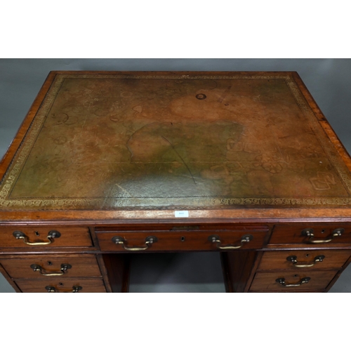 860 - A Victorian mahogany partner's desk, the gilt tooled green leather inset top over a trio of frieze d... 