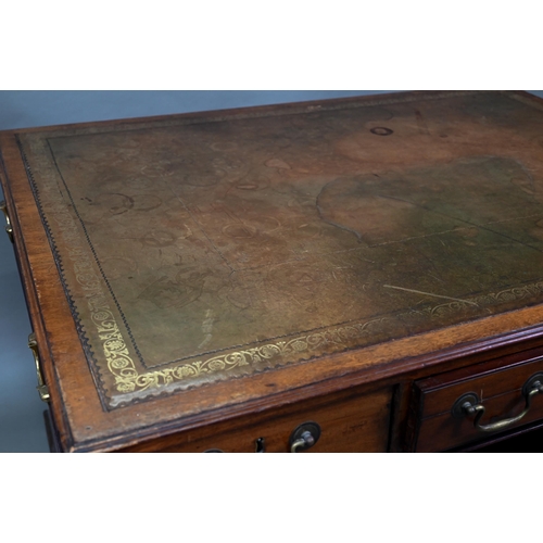 860 - A Victorian mahogany partner's desk, the gilt tooled green leather inset top over a trio of frieze d... 