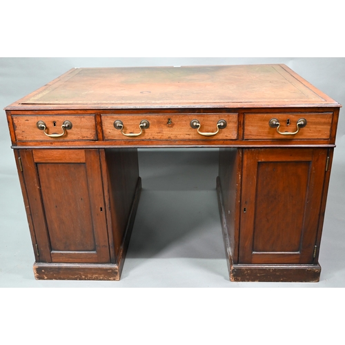 860 - A Victorian mahogany partner's desk, the gilt tooled green leather inset top over a trio of frieze d... 