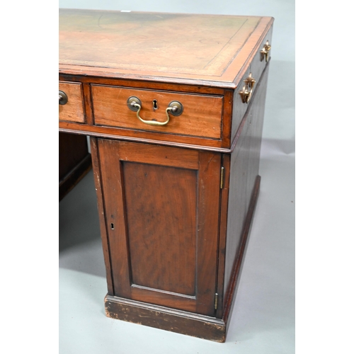 860 - A Victorian mahogany partner's desk, the gilt tooled green leather inset top over a trio of frieze d... 