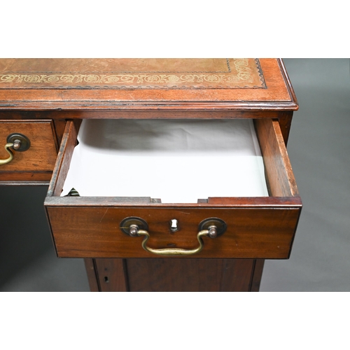 860 - A Victorian mahogany partner's desk, the gilt tooled green leather inset top over a trio of frieze d... 