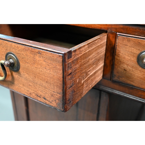 860 - A Victorian mahogany partner's desk, the gilt tooled green leather inset top over a trio of frieze d... 