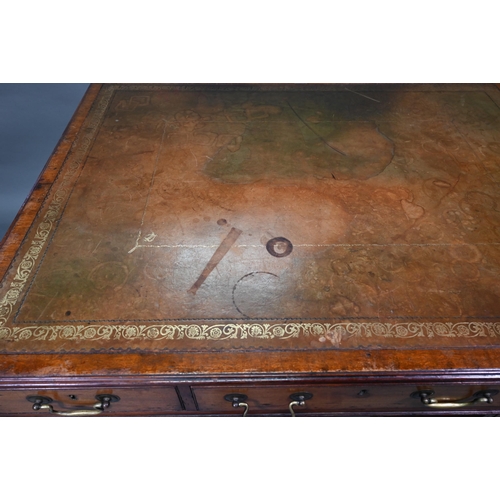 860 - A Victorian mahogany partner's desk, the gilt tooled green leather inset top over a trio of frieze d... 