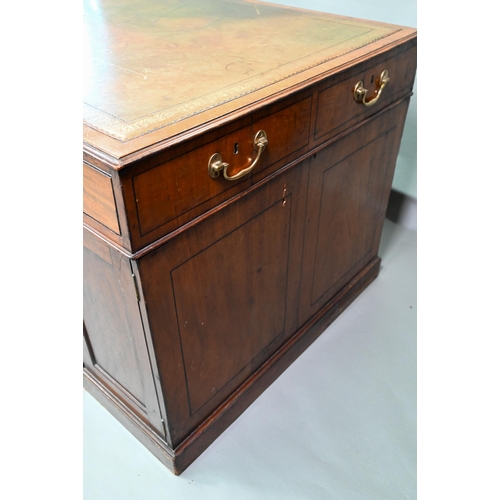 860 - A Victorian mahogany partner's desk, the gilt tooled green leather inset top over a trio of frieze d... 