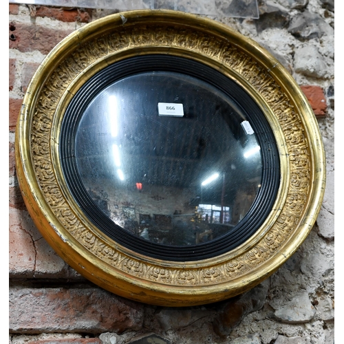 866 - An antique gilt and gesso convex mirror, 36 cm dia.