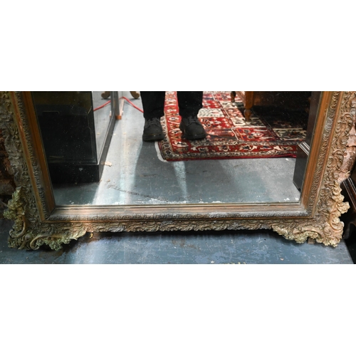 867 - An antique French gilt gesso mirror, surmounted by a garland festooned urn, 155 cm h x 102 cm