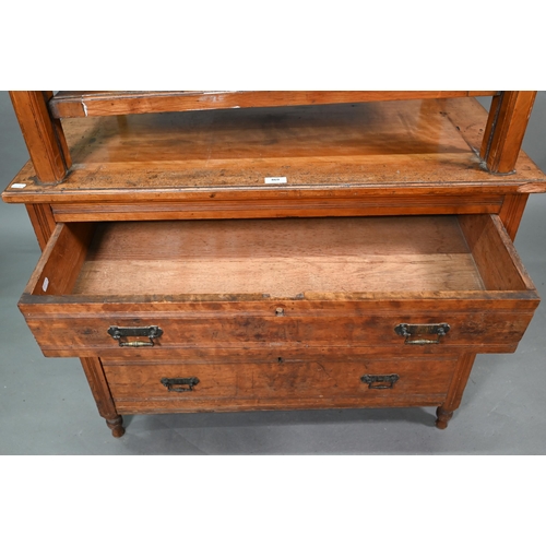 869 - A late 19th century walnut book press chest, the brass bound nautical style adjusting wheel over thr... 