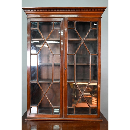 871 - A Victorian mahogany cabinet with pair of Arabic arched panel doors over two long drawers, raised on... 