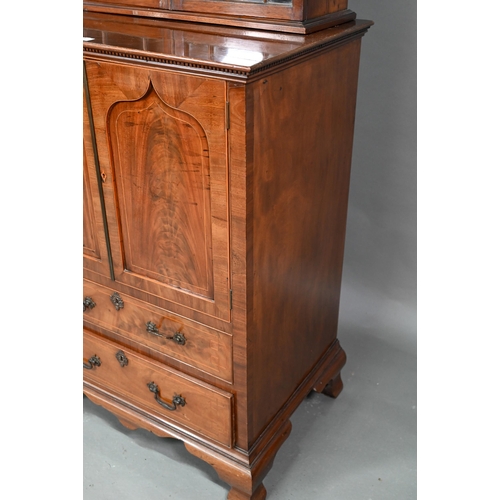 871 - A Victorian mahogany cabinet with pair of Arabic arched panel doors over two long drawers, raised on... 