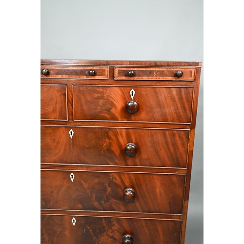 875 - A Victorian mahogany chest of three shallow drawers over two short and three long graduated drawers,... 