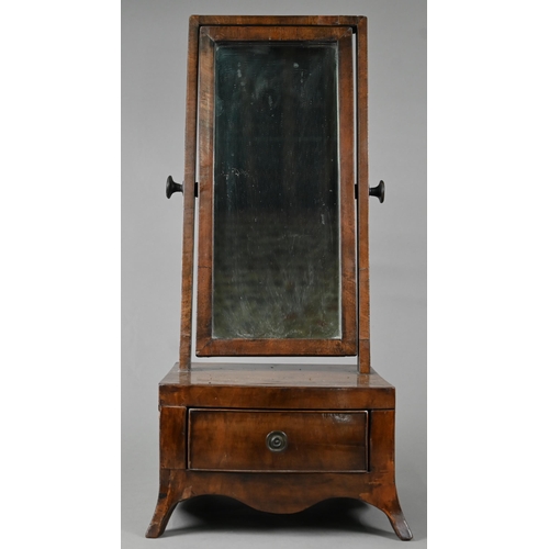 876 - A compact 19th century mahogany toilet mirror, raised on a single bow-fronted drawer base, on splaye... 