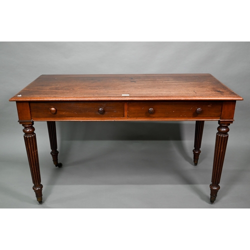 877 - A Victorian mahogany two drawer side table, raised on turned reeded legs to brass castors, 122 cm w ... 