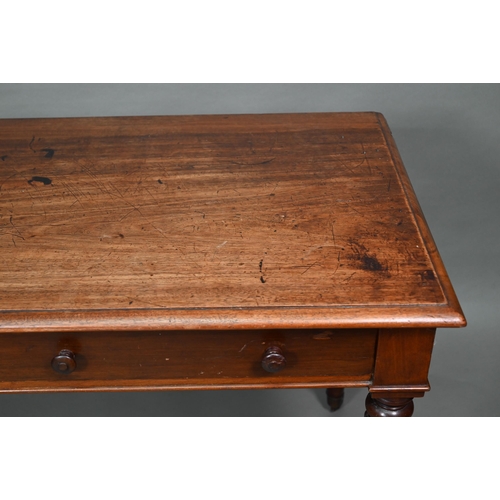 877 - A Victorian mahogany two drawer side table, raised on turned reeded legs to brass castors, 122 cm w ... 