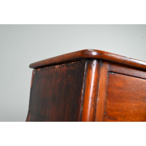 878 - An old miniature mahogany chest of two short over three long graduated drawers, with turned pulls, o... 