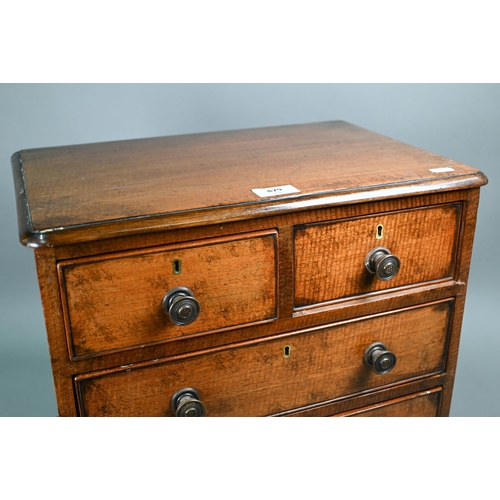 879 - A late 19th century miniature mahogany chest of two short over two long graduated with metal pulls, ... 