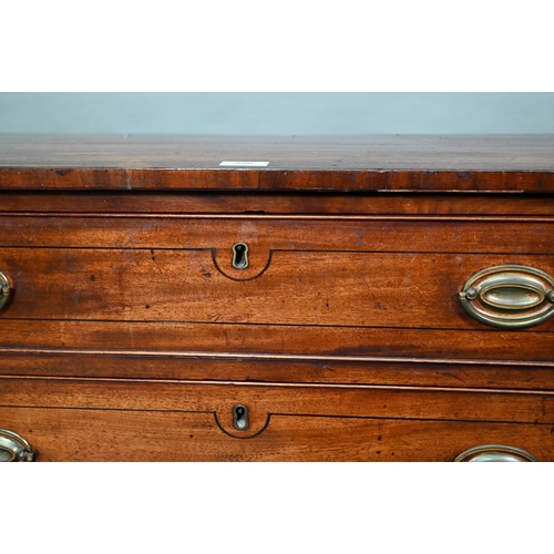 880 - A 19th century mahogany chest of four long graduated drawers, raised on spayed bracket feet, later b... 