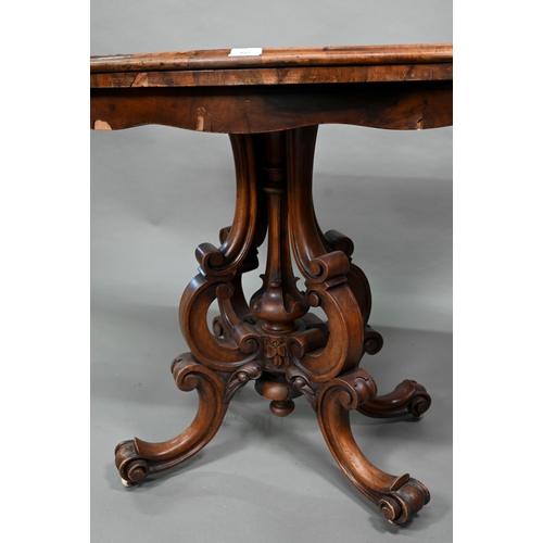 881 - A Victorian walnut card table, the fold over serpentine top with baize lining, raise on moulded clus... 