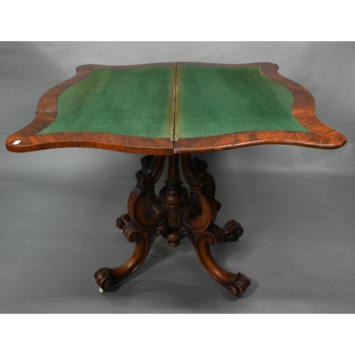 881 - A Victorian walnut card table, the fold over serpentine top with baize lining, raise on moulded clus... 