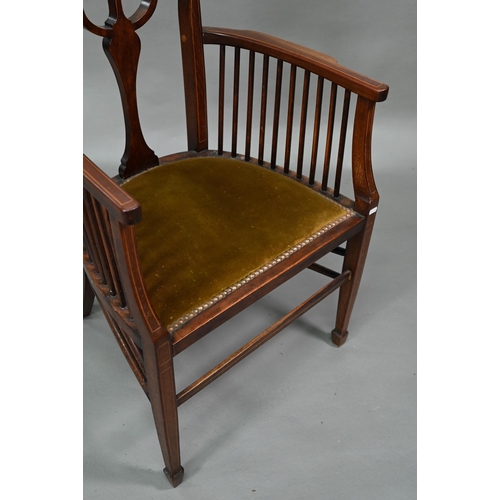 884 - An Arts & Crafts Liberty style carver chair, with shaped back and fabric seat