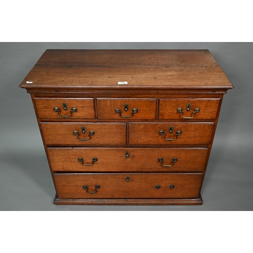 886 - A small 18th century oak chest of three short over two short and two long graduated drawers, with br... 