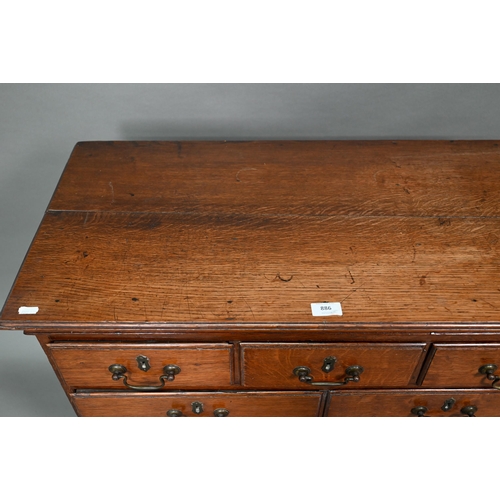 886 - A small 18th century oak chest of three short over two short and two long graduated drawers, with br... 