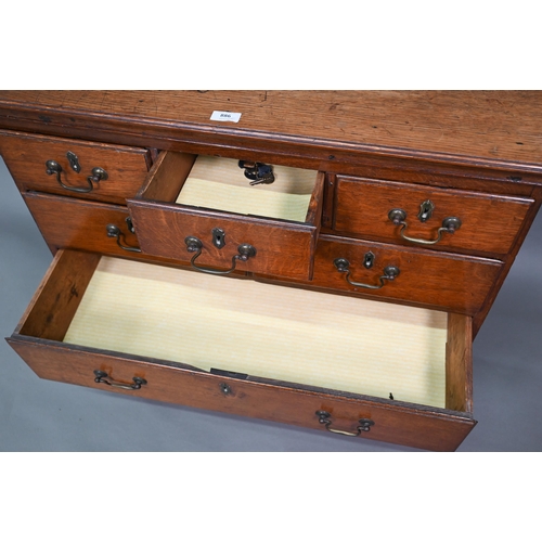 886 - A small 18th century oak chest of three short over two short and two long graduated drawers, with br... 