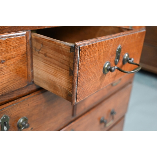 886 - A small 18th century oak chest of three short over two short and two long graduated drawers, with br... 