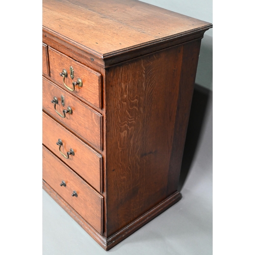 886 - A small 18th century oak chest of three short over two short and two long graduated drawers, with br... 