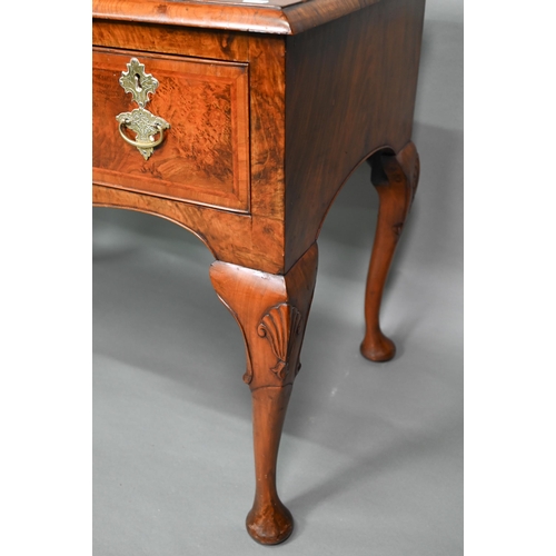 887 - A Georgian style cross and feather-banded quarter veneered walnut side table with three drawers with... 