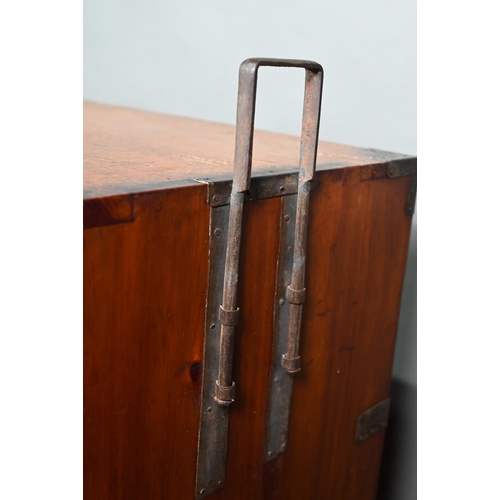 888 - An antique Japanese steel bound softwood ledger chest, with an arrangement of drawers around a slide... 