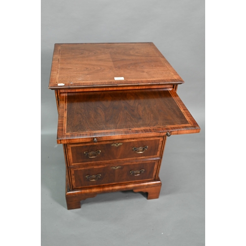 889 - A well executed Georgian style small cross and feather-banded walnut chest of four drawers beneath a... 