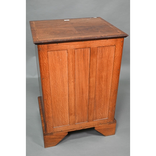 889 - A well executed Georgian style small cross and feather-banded walnut chest of four drawers beneath a... 