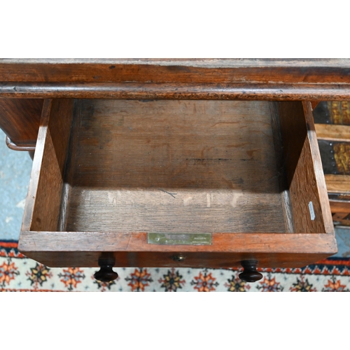 891 - A William VI mahogany cylinder top desk, the 3/4 gallery top over a leather top slide and stationary... 