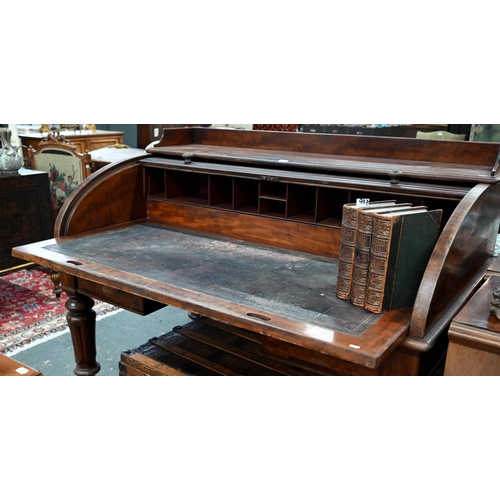 891 - A William VI mahogany cylinder top desk, the 3/4 gallery top over a leather top slide and stationary... 