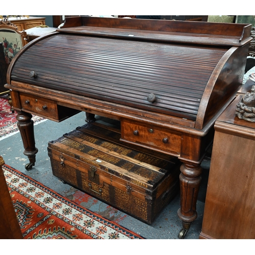 891 - A William VI mahogany cylinder top desk, the 3/4 gallery top over a leather top slide and stationary... 