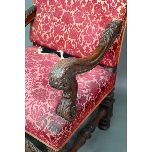 903 - A Victorian carved and moulded oak framed throne chair, with remnants of plush fabric back and seat ... 