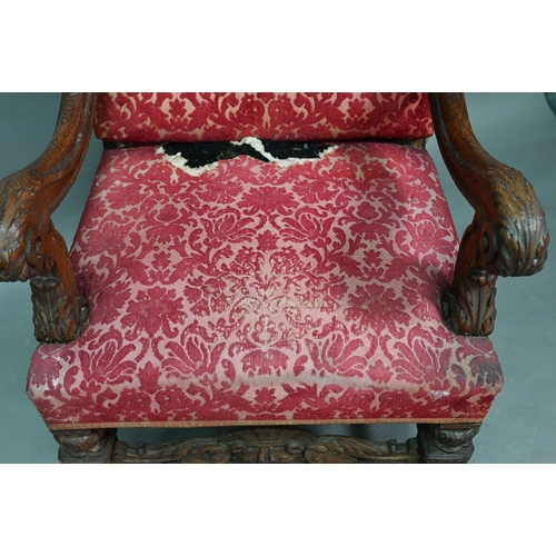 903 - A Victorian carved and moulded oak framed throne chair, with remnants of plush fabric back and seat ... 