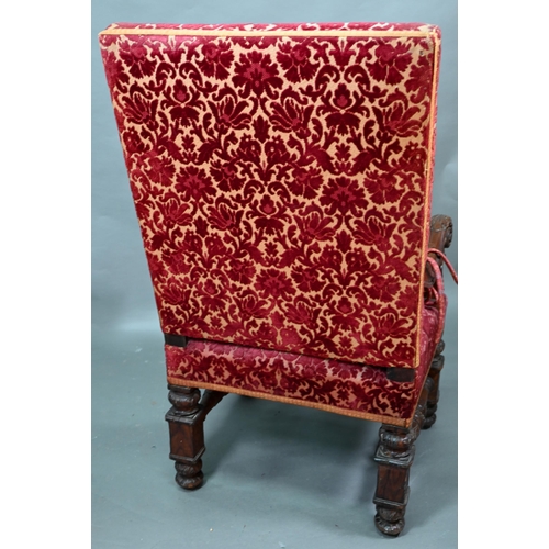 903 - A Victorian carved and moulded oak framed throne chair, with remnants of plush fabric back and seat ... 