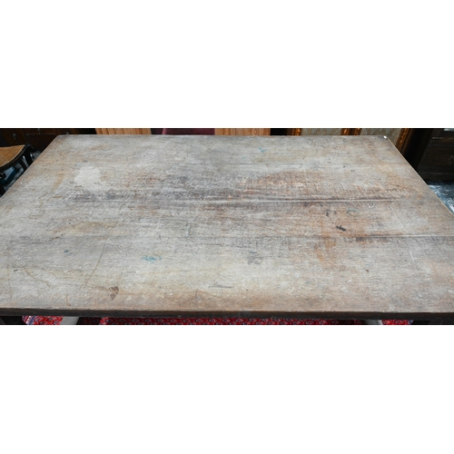 908 - An antique oak refectory table, the wide four plank top over a plain frieze and joint frame with tur... 