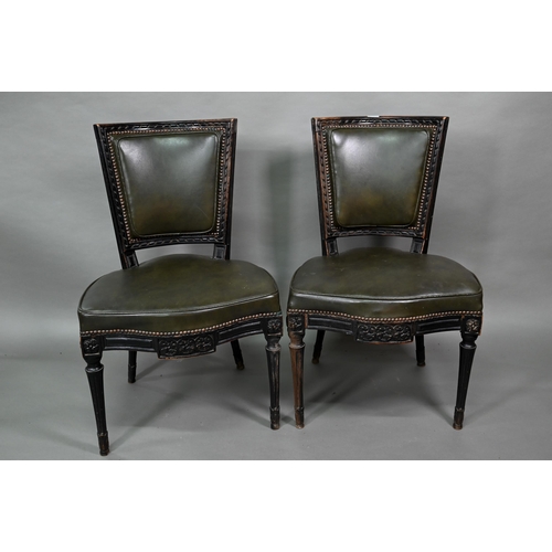 912 - A pair of antique French Empire green studded leather side chairs, with moulded ebonised walnut fram... 